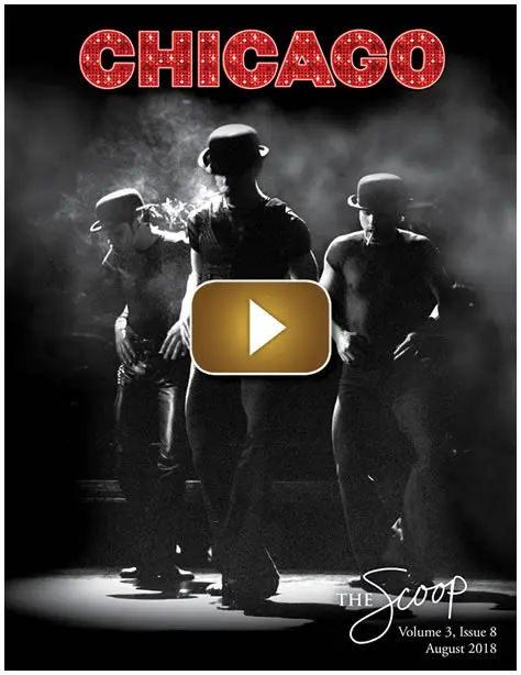 Silhouetted dancers performing on a smoky stage with dramatic lighting.