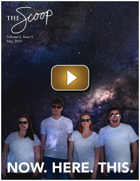 Four people posing under a starry night sky with a Milky Way backdrop.