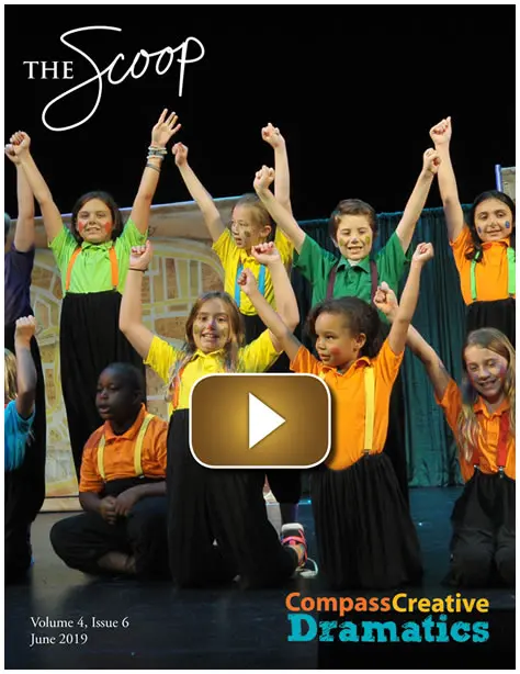Children joyfully performing on stage in colorful costumes.