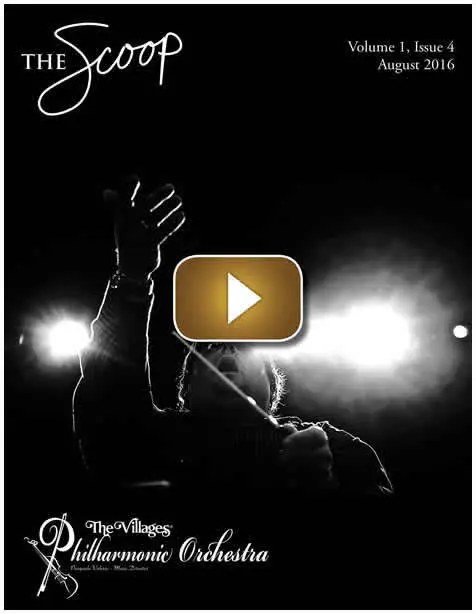 Silhouette of a person raising a hand against bright stage lights.