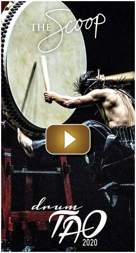 Man performing a high kick with a sword in an intense martial arts setting.