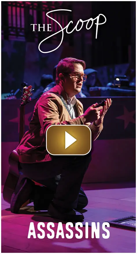 Actor performing on stage with dramatic lighting and costume.