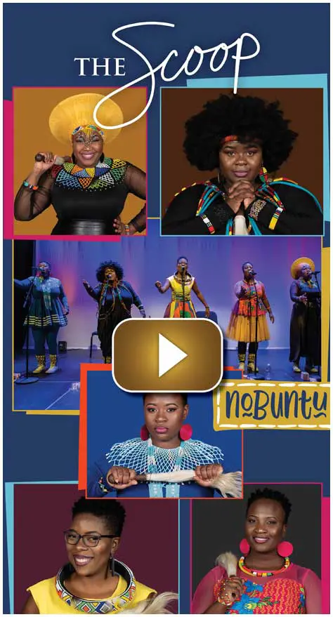 Vibrant performance with expressive gestures and colorful outfits on stage.