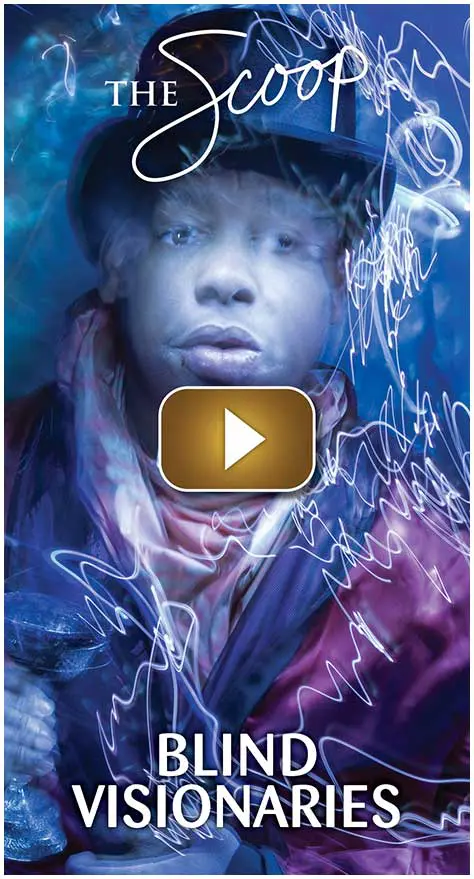 A person surrounded by vibrant neon light trails in a dark setting.