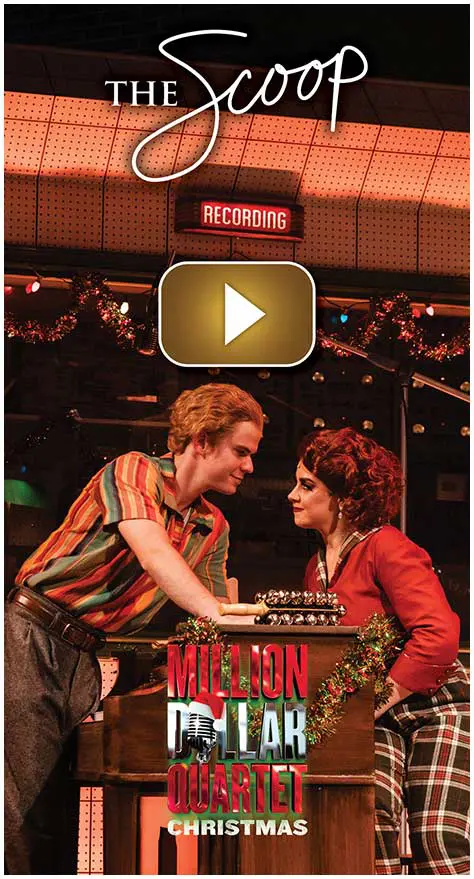 Two performers in costume share a moment on stage with a vintage microphone.