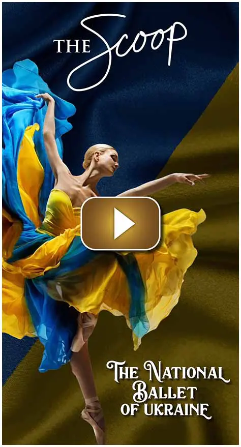 A dancer in a flowing yellow and blue dress performs gracefully.