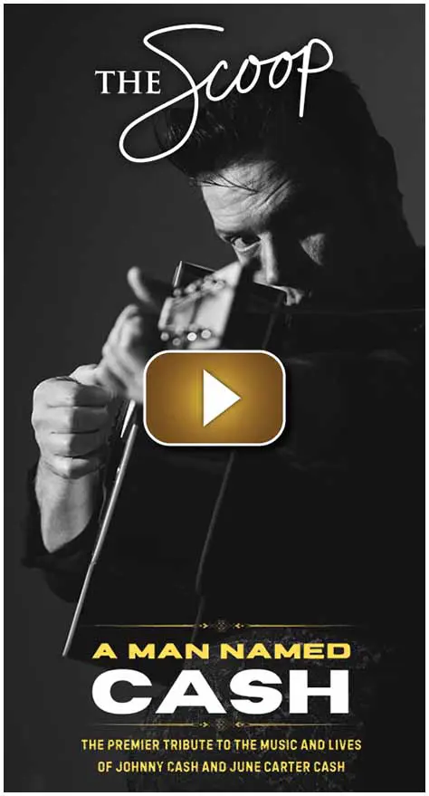 Black and white photo of a musician playing guitar passionately.